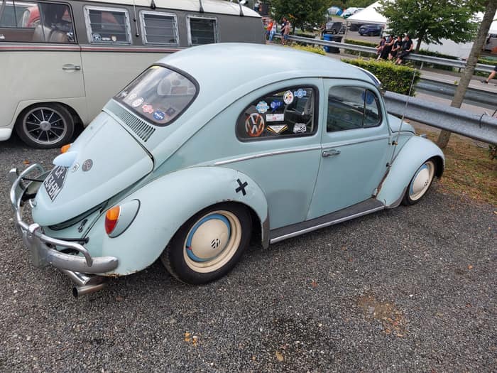Aircooled Volkswagens parked together at the Spa Francorchamps circuit.