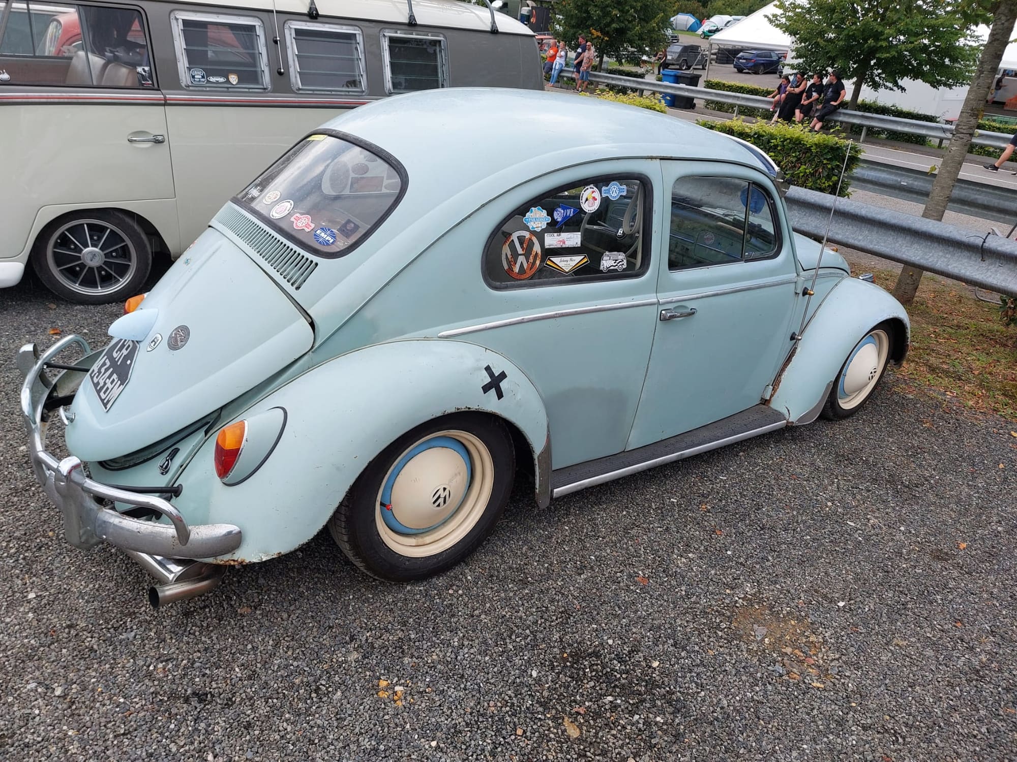 Aircooled Volkswagens parked together at the Spa Francorchamps circuit.